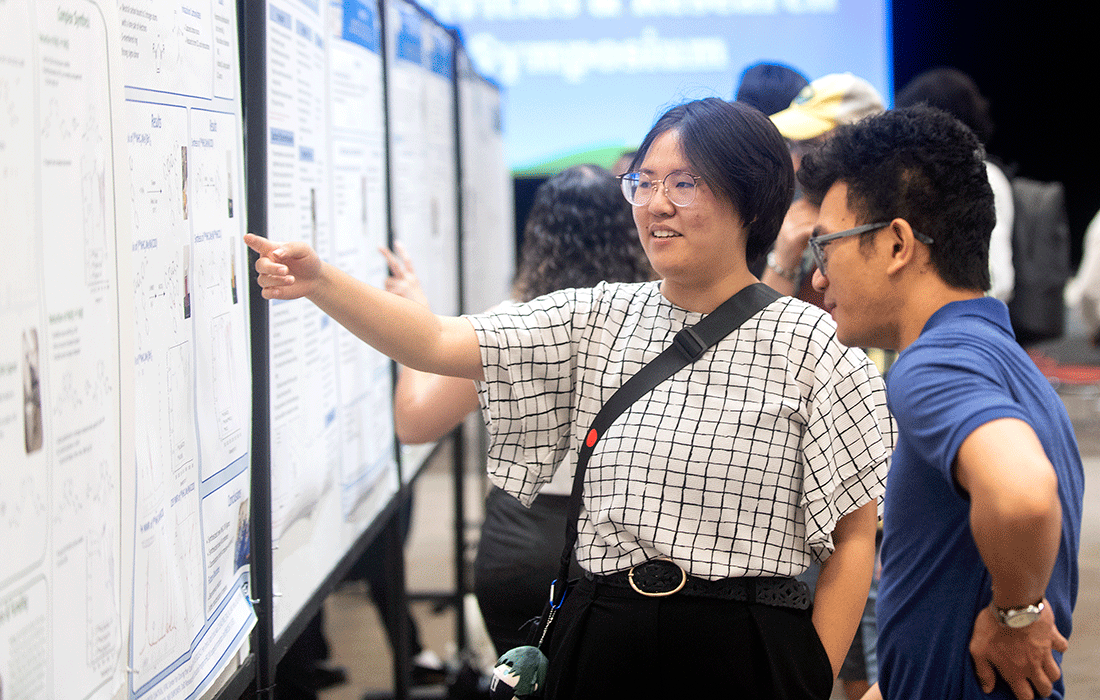 A female student presents her research.