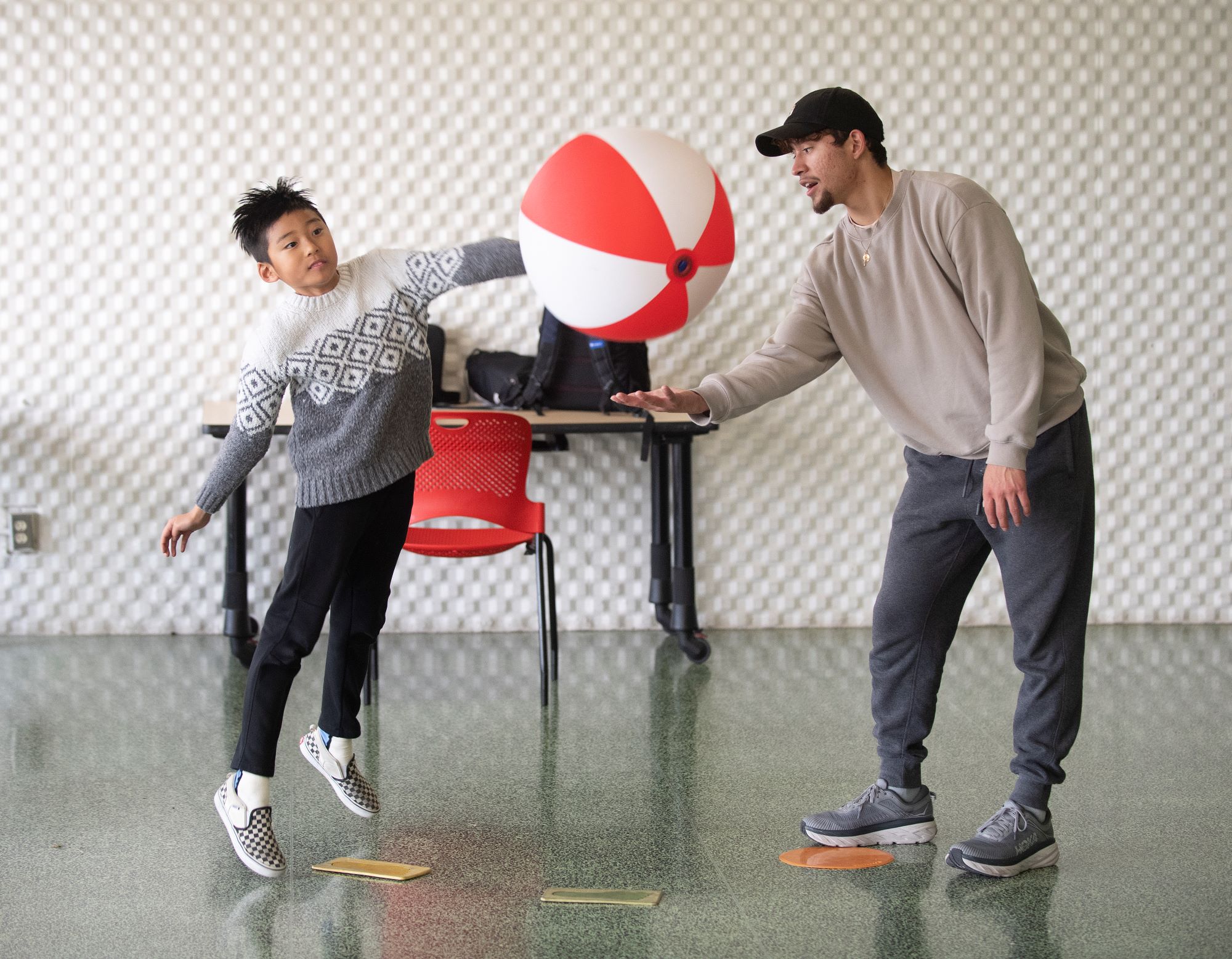 A student works with a child in the motor development clinic.