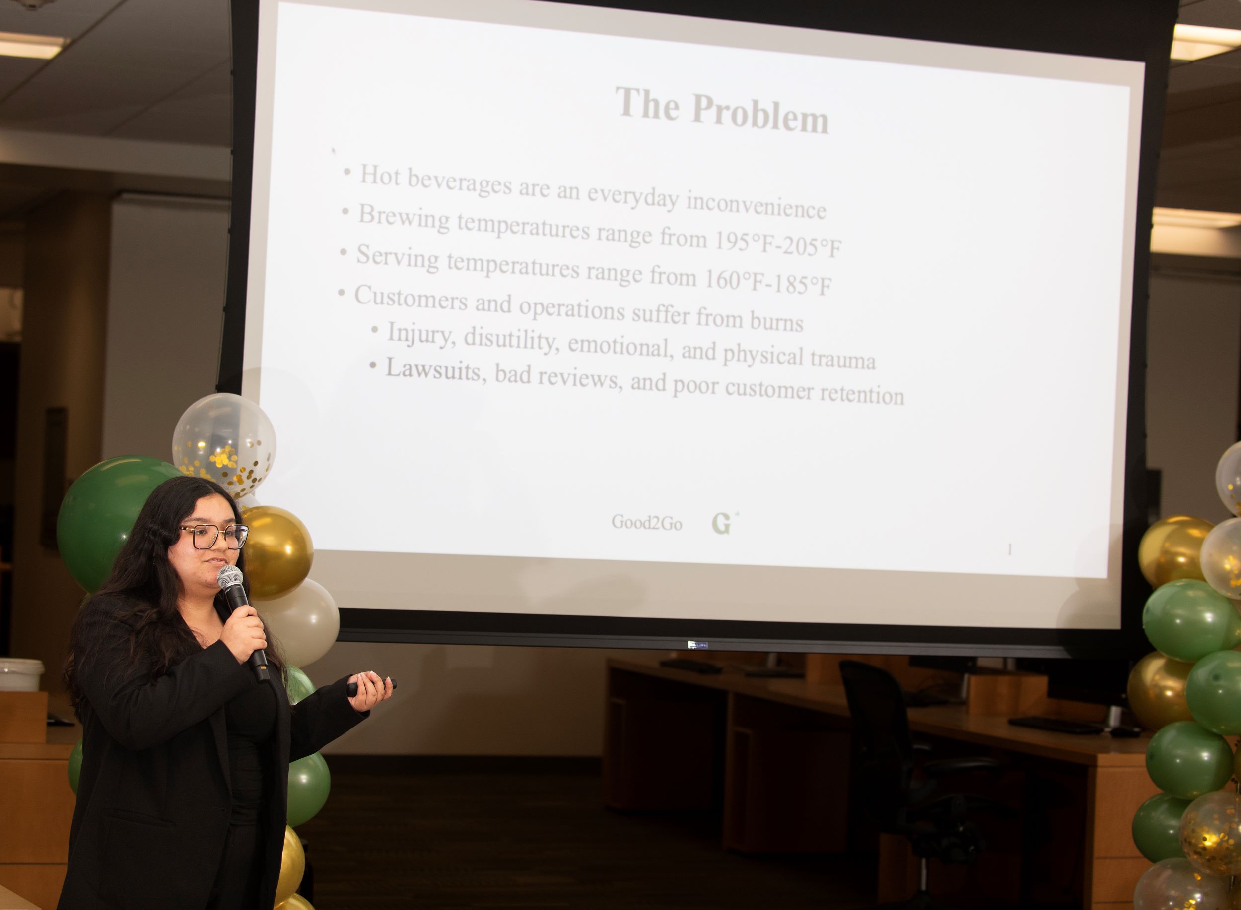 Female student presents research during the Fastpitch Competition.