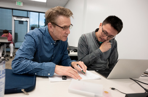 Professor working with student