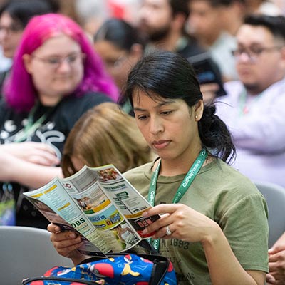 transfer students looking at a brochure in class