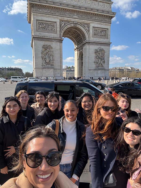 AMM students pose in front of the Arc de Triomphe in Paris.