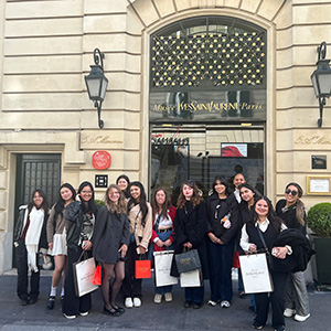 AMM students pose outside the Yves Saint Laurent Museum.