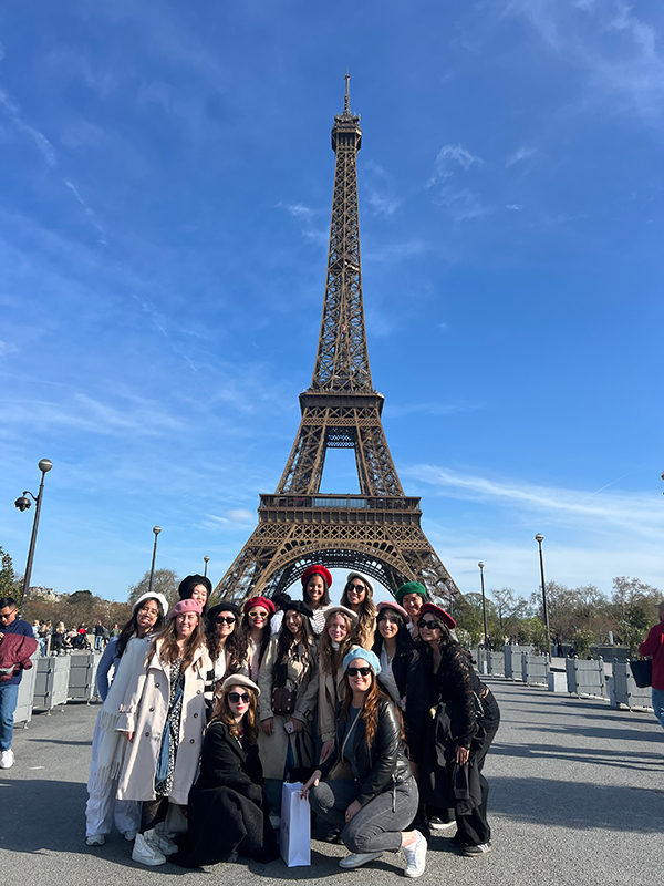AMM students pose in front of the Eiffel Tower.