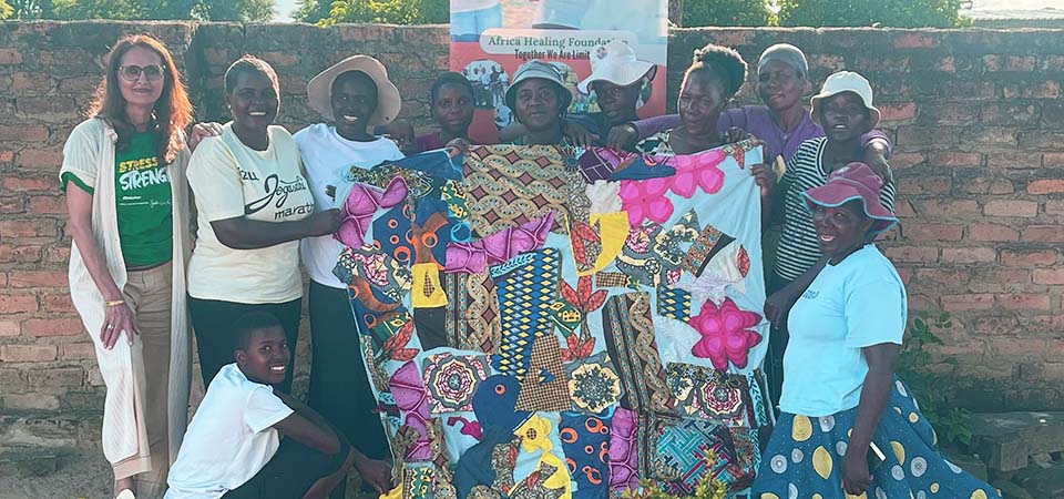 Naveen Hyder, top left, poses with some of her African students.