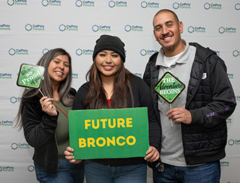 student holding future bronco sign