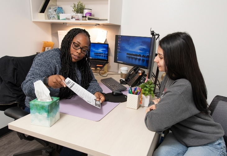 Care Center staff assists a student with their case