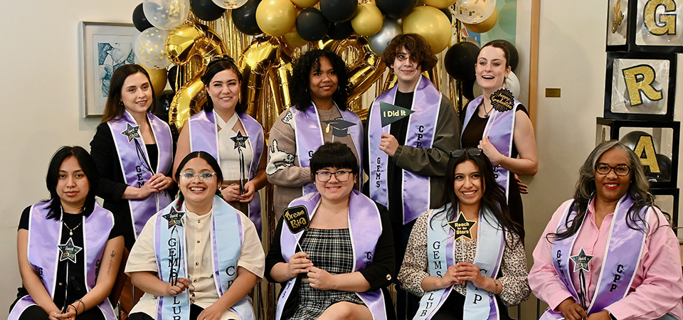 some students celebrating graduation with props