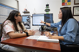 Advisor Annette helps a student