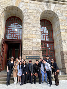 students standing in front of building