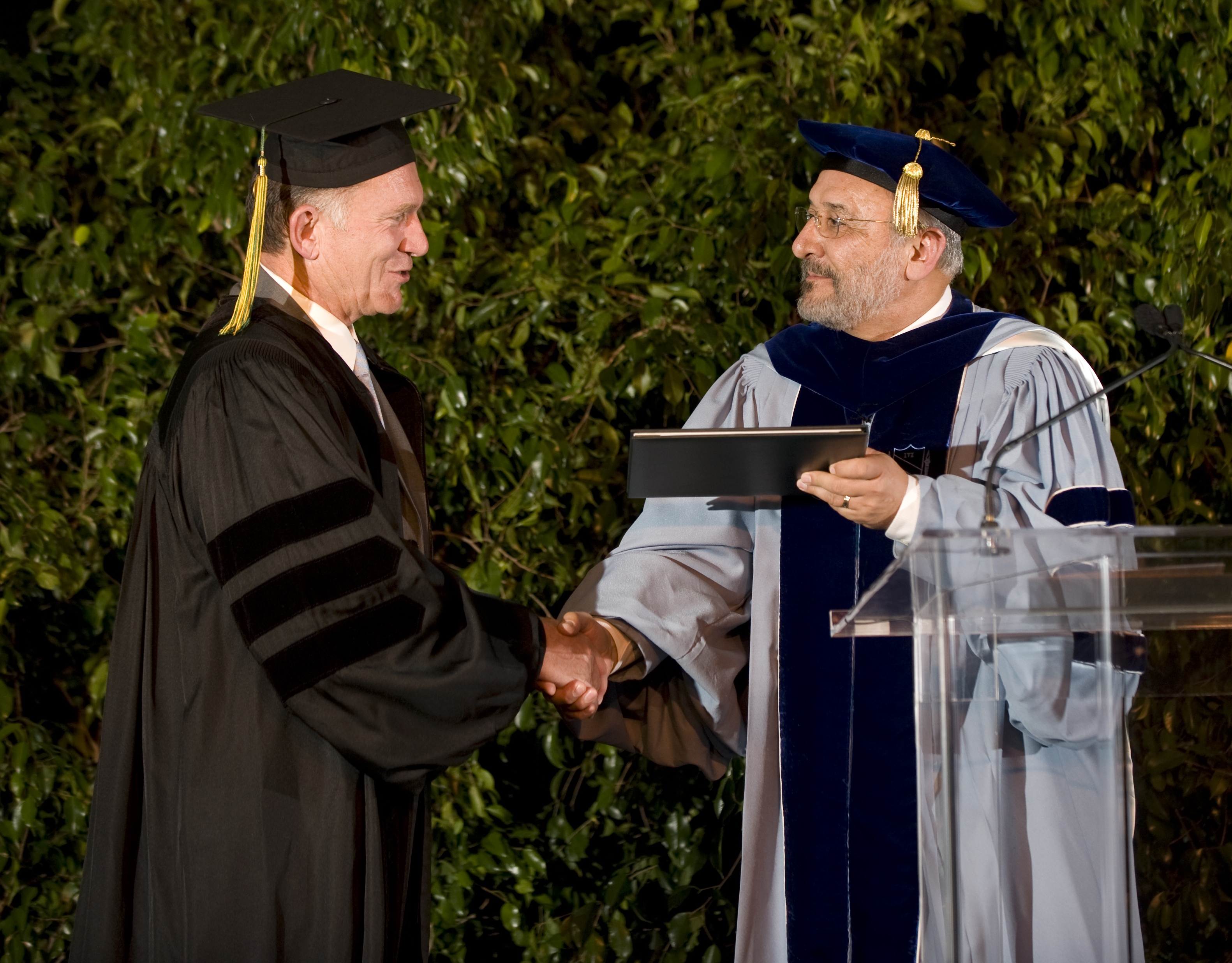 Mark Peel receives his diploma during a surprise presentation at Harvest Auction 2009.