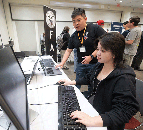 Lindsey Lam tries her hand at Mincraft at the Artificial Intelligence Fair at Cal Poly Pomona April 17, 2024.