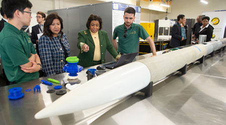 President Coley and students in the Liquid Rocket Lab