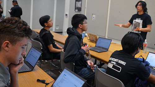 A Cal Poly Pomona student demonstrates to an audience