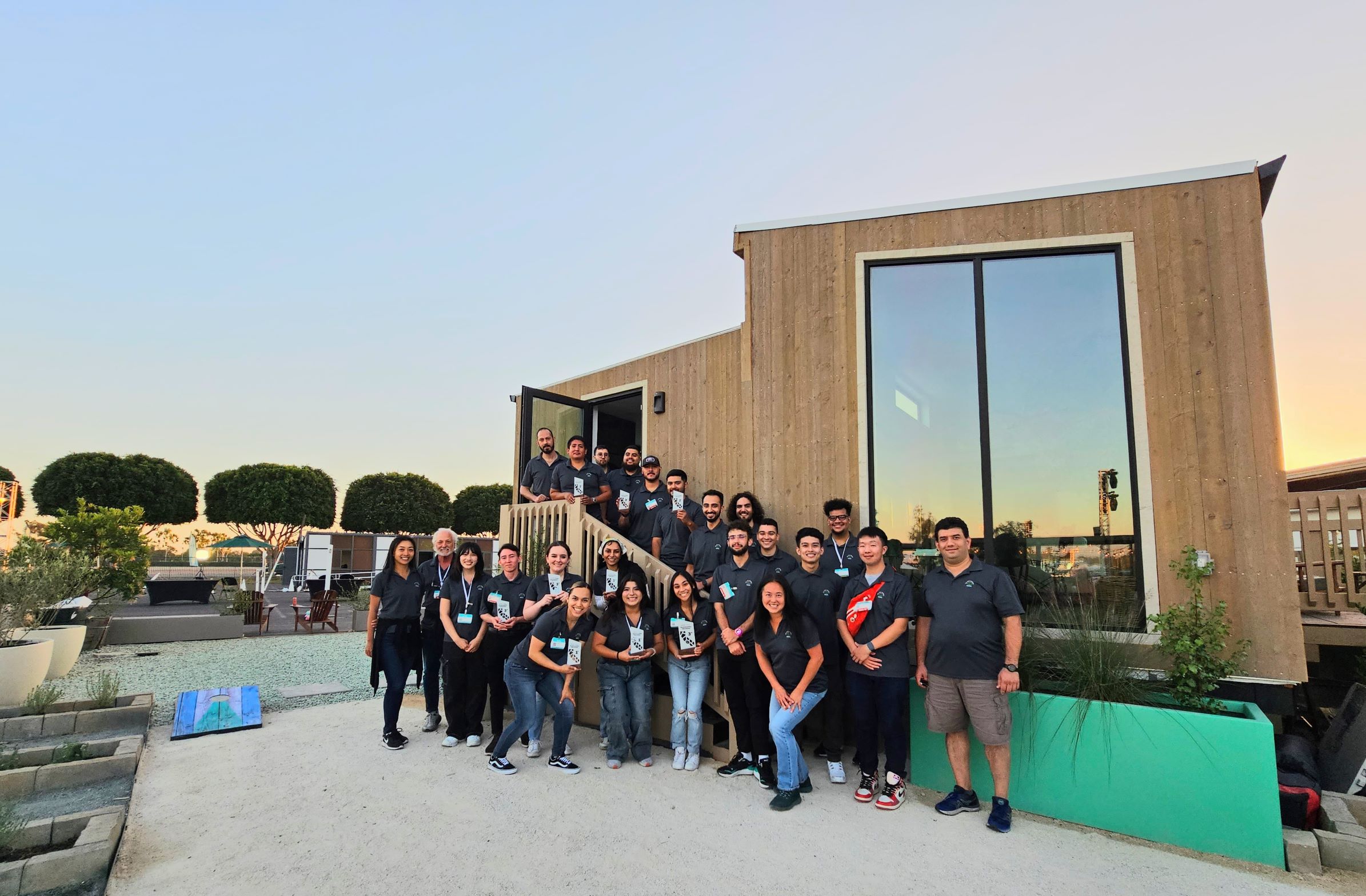 The Cal Poly Pomona Roots House team in front of their project.