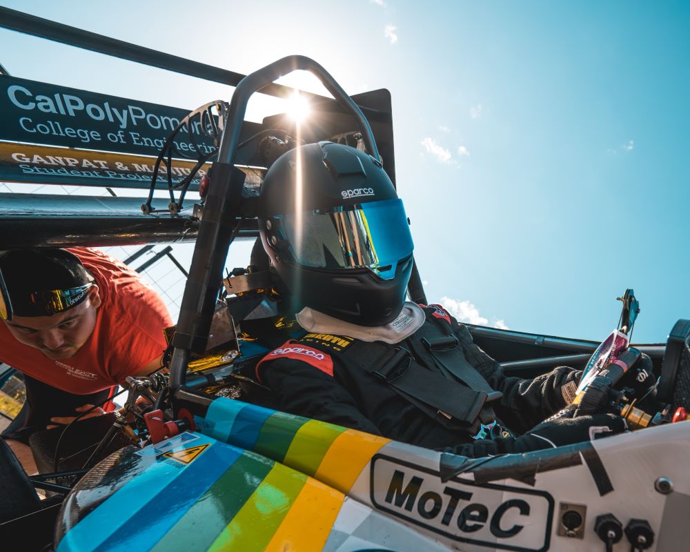 A Cal Poly Pomona student driver in the FSAE formula race car.