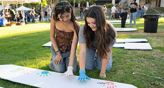 New students leave handprints on the CPP Letters.