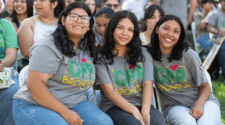 Three female students pose for a photo during the first day of the fall semester.