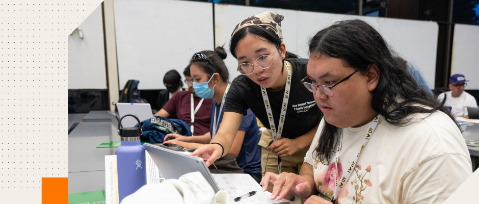 students looking at a laptop screen