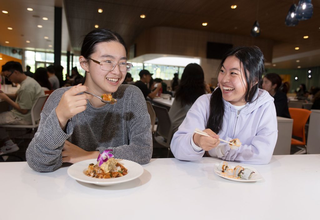 oyce Chen enjoys Halal food while friend Annie Cho has sushi at Centerpointe Dining Commons.