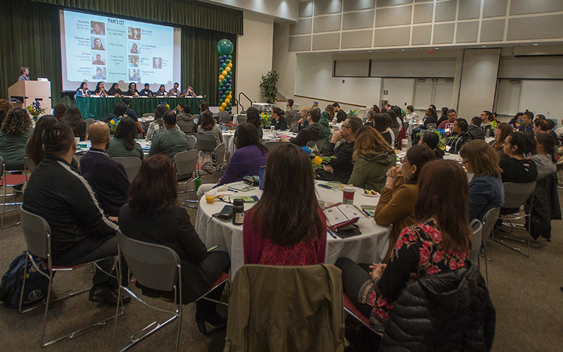 A group of people attend the CSU counselor conference.