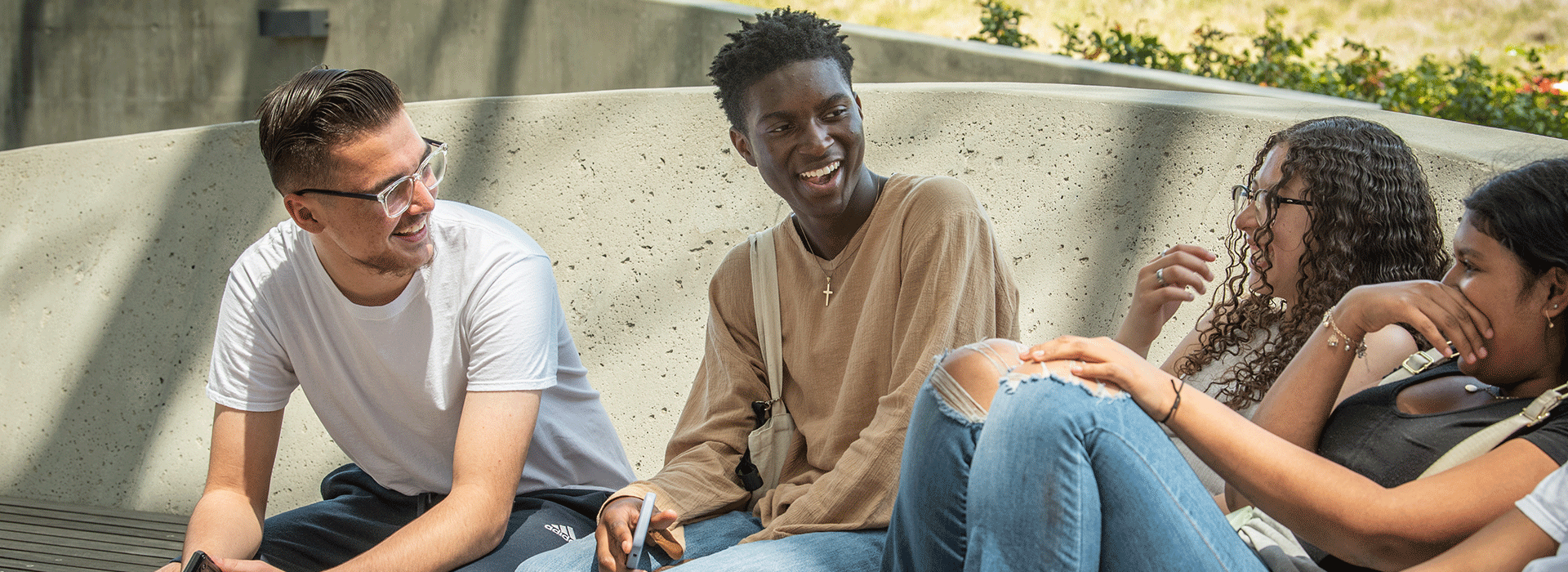 Students talk and smile in a group