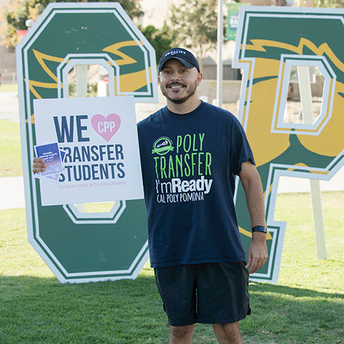 Transfer student holding up we love cpp transfer students sign.