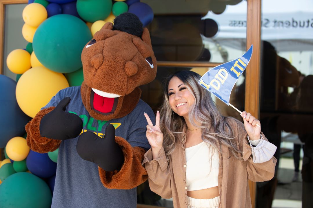 Billy Bronco poses in PolyTransfer T-Shirt with a transfer student.