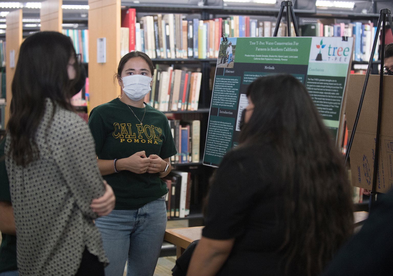 Picture of students who chose to attend the PolyX showcase event in-person, following social distancing and masking protocols.