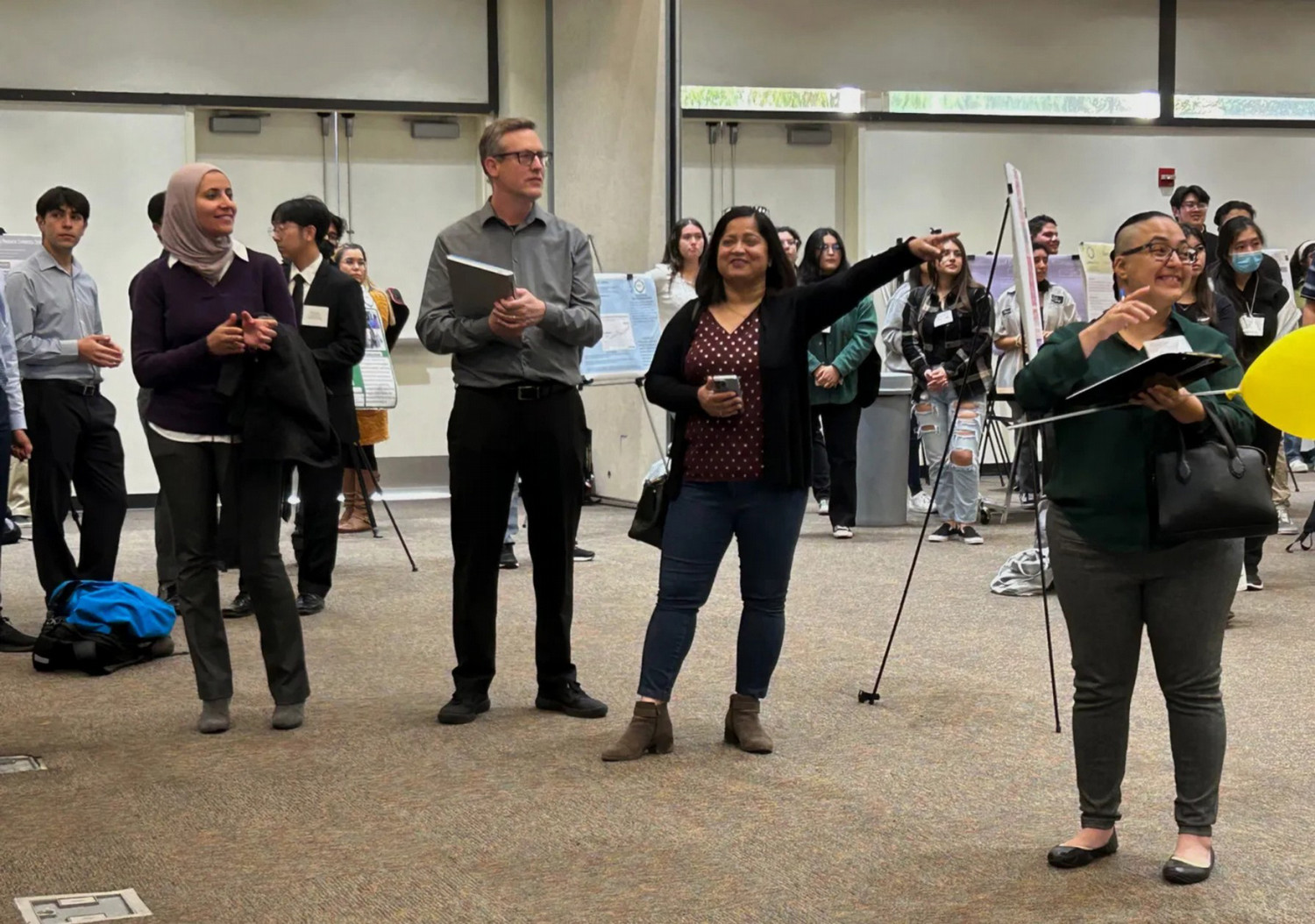 Picture of Dr. Gad, Dr. Wadhwa, and other audience members attending the PolyX Showcase event.