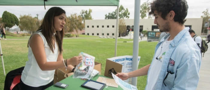 Students talk with a representative from student health