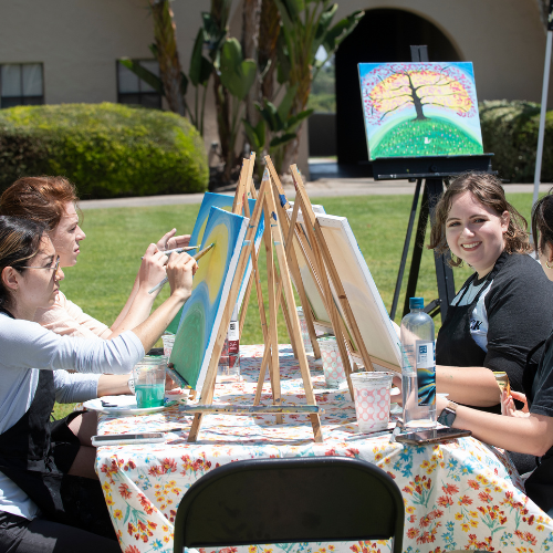 Students painting during an ASI event