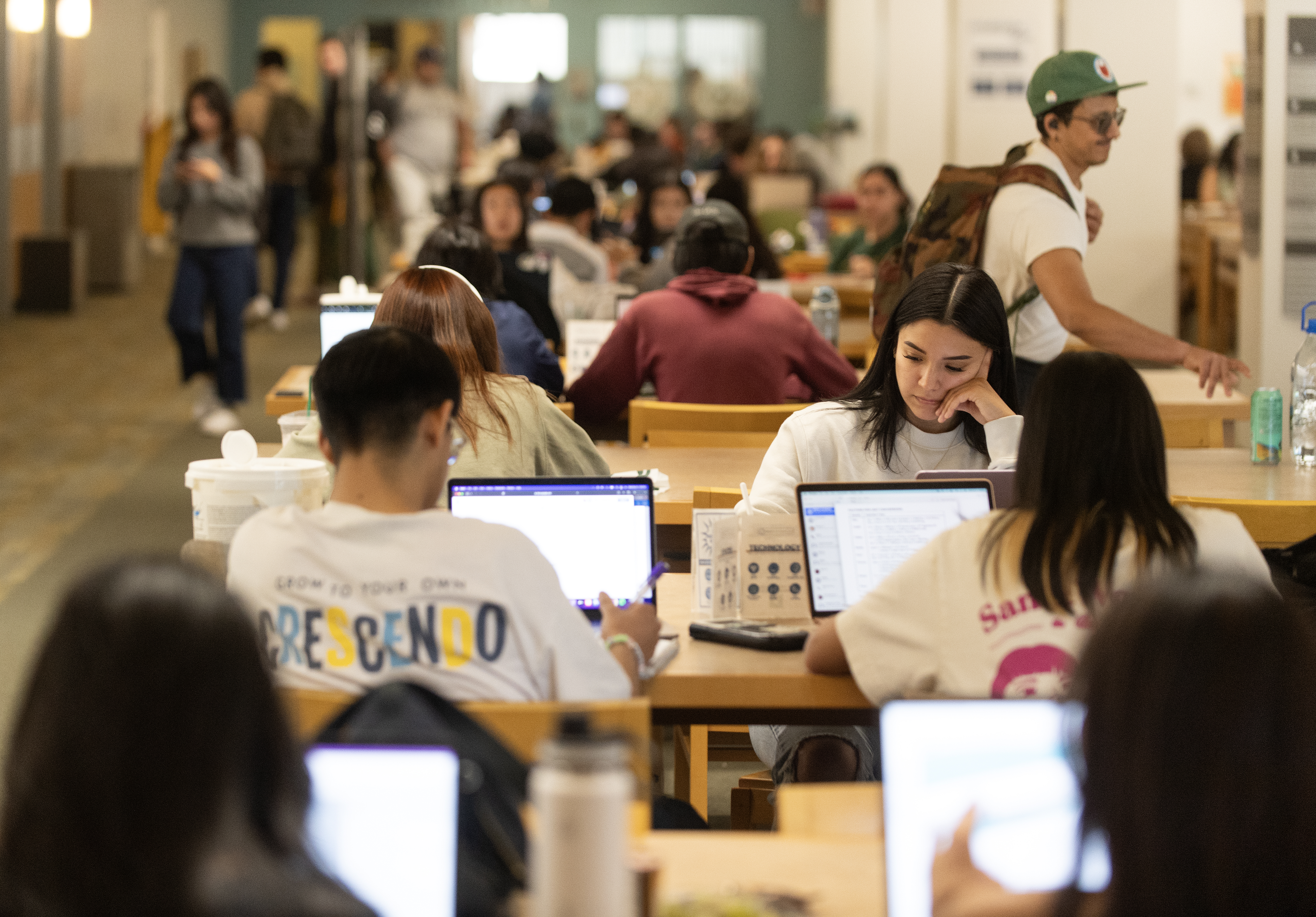 Library interior with students studying