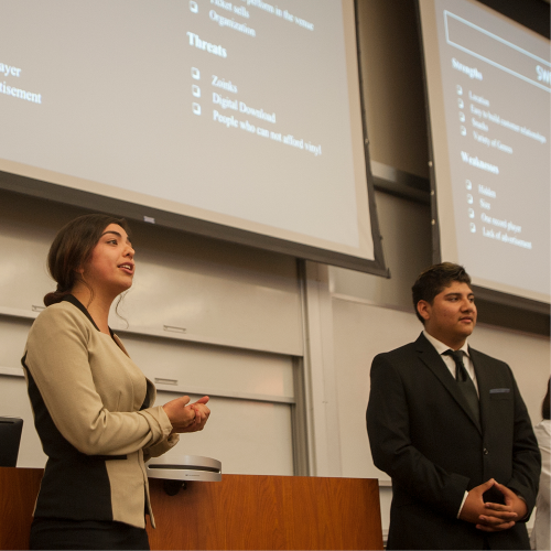 Two students present on a project