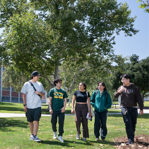 A group of students walk together in University Quad